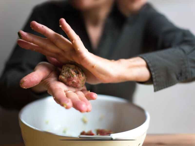 Rolling the Mixture Into Small Meatballs.