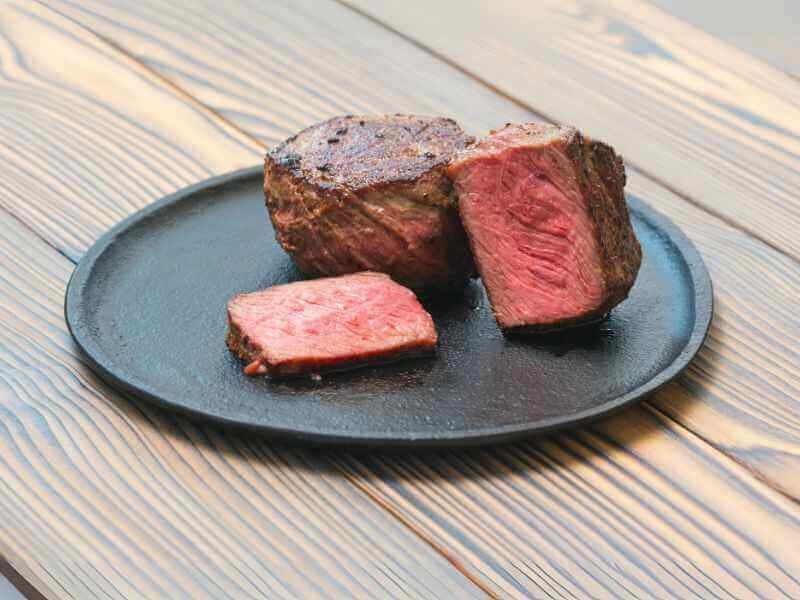 Pan-seared beef cubes served on a plate. 