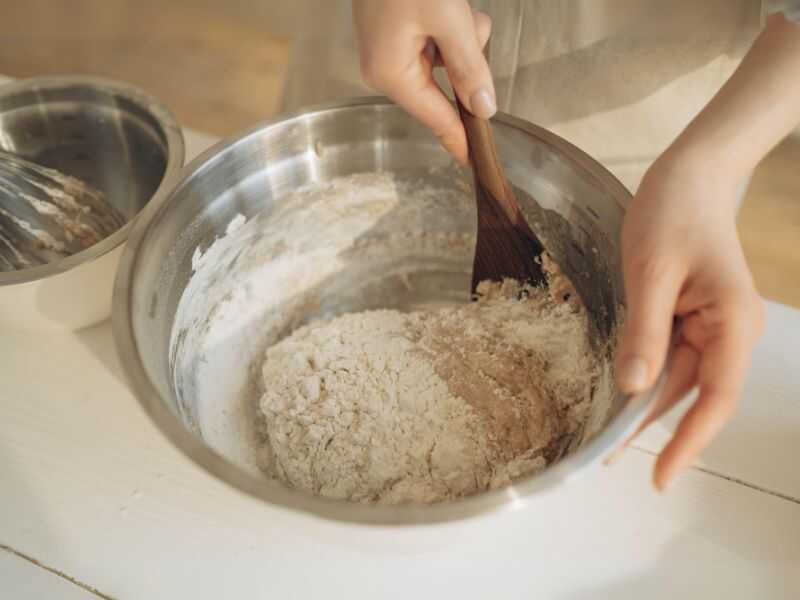 A Women Mixing Ingredients in a Mixing Bowl