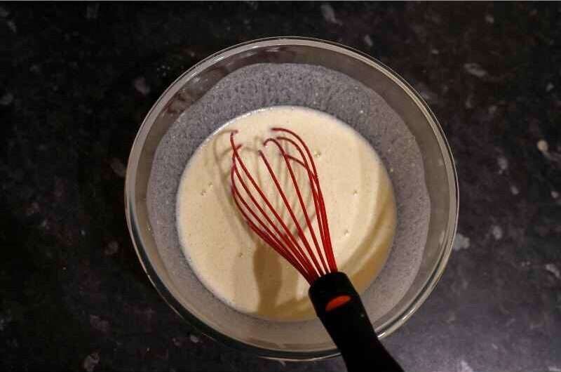 A bowl of batter with a whisker in it