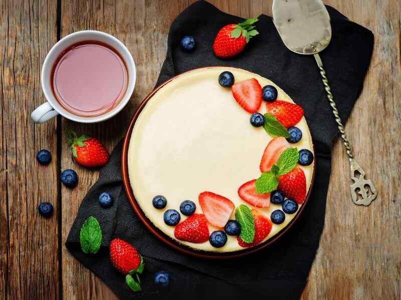 A cheesecake with berry toppings