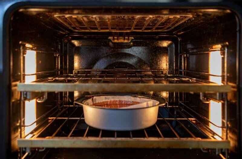 An oven with a cake in it