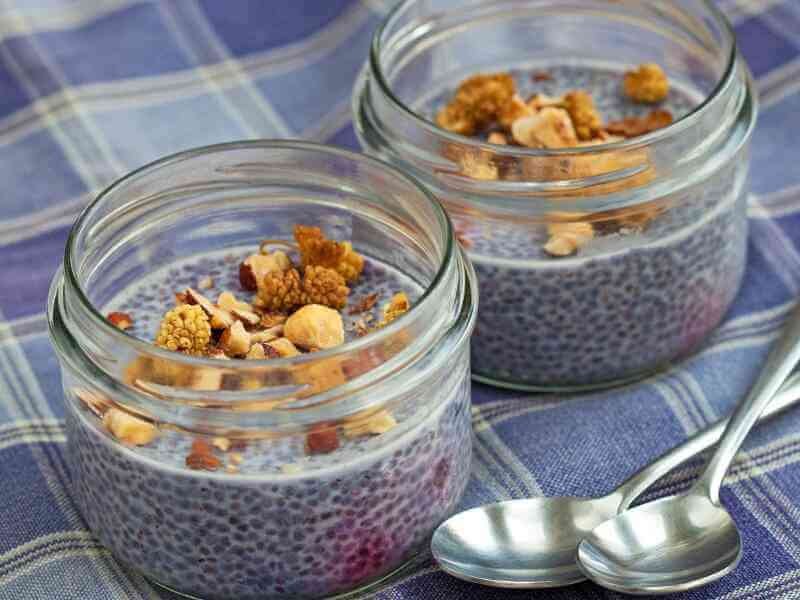 Scooping the chia pudding mixture into your airtight containers 