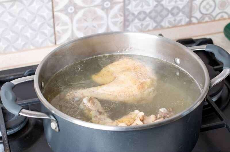 pot on the stove and heat the chicken stock