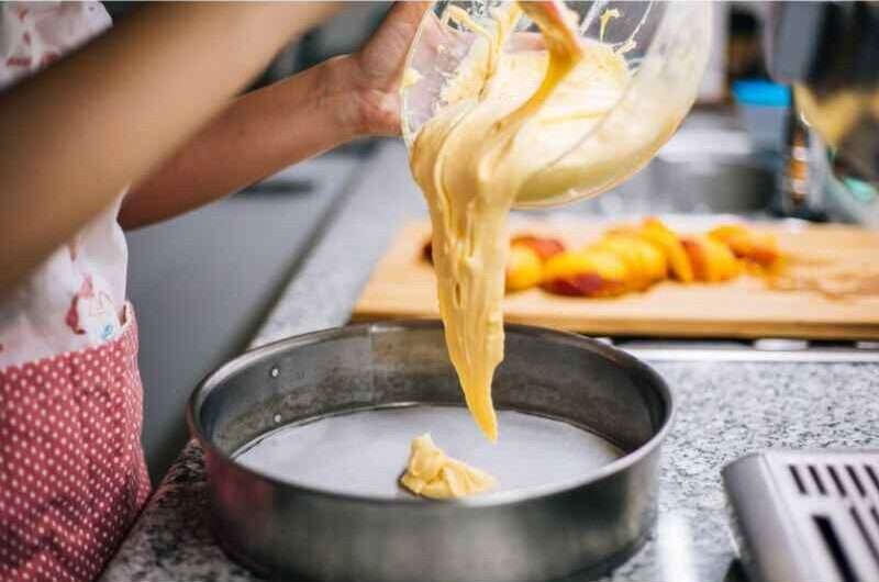 Pouring cake batter in a pan