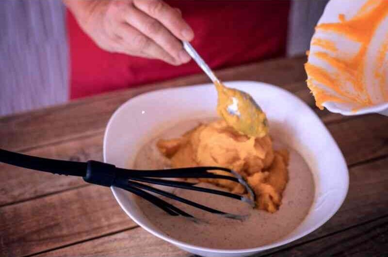 mixing the pumpkin puree and spice cake mix together.