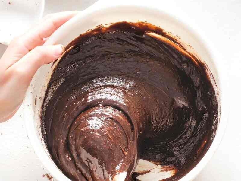 Mixing chocolate brownies batter