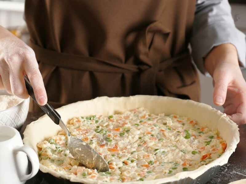 pour the chicken mixture into the crust and spread it evenly