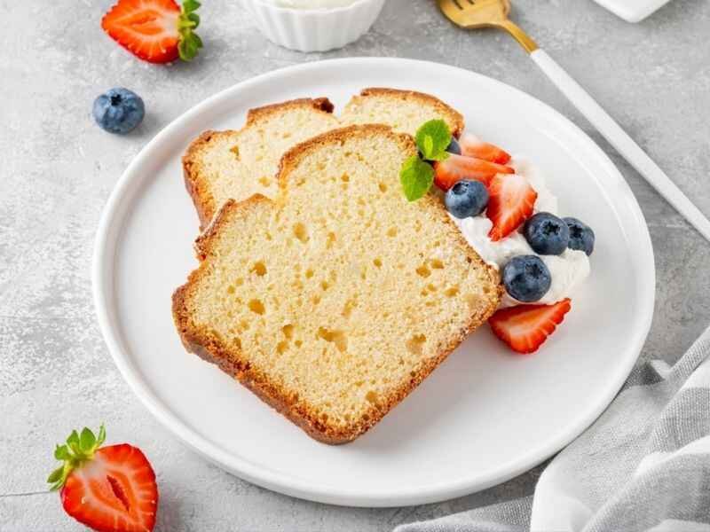 serve cake with fresh berries and whipped cream