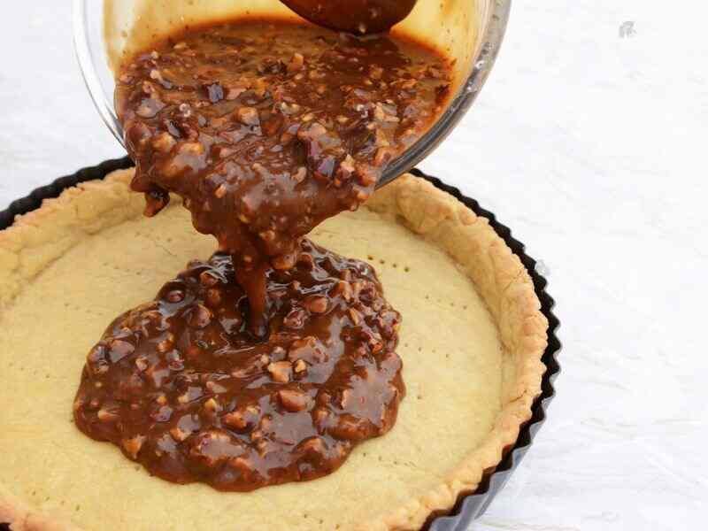 pour the pecan filling over the baked tart base